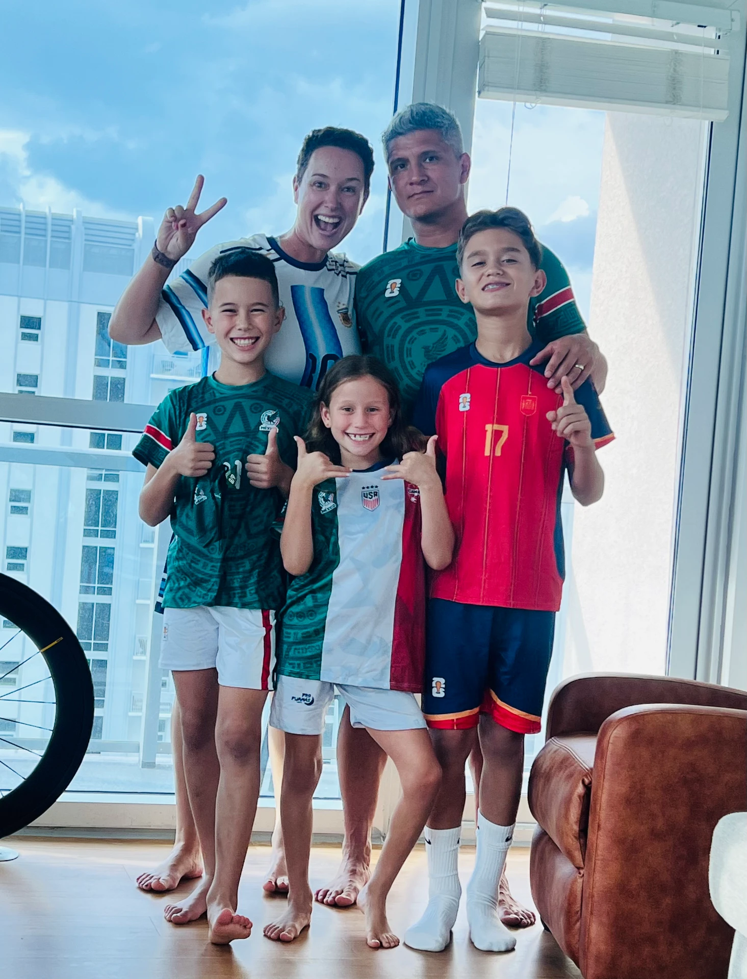 The WorldshakerKids family smiling together at home