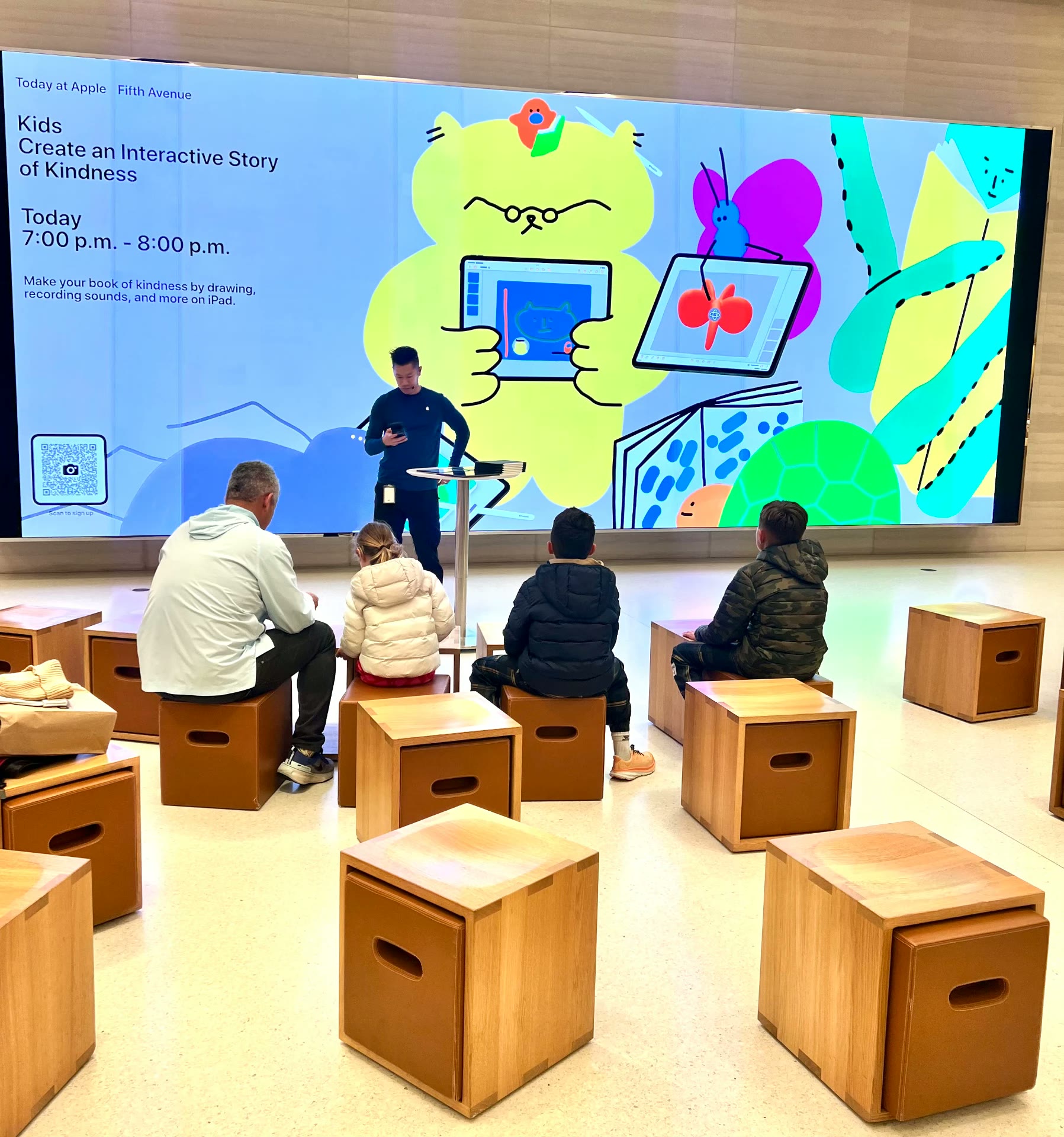 Children at a technology workshop creating a digital story on tablets